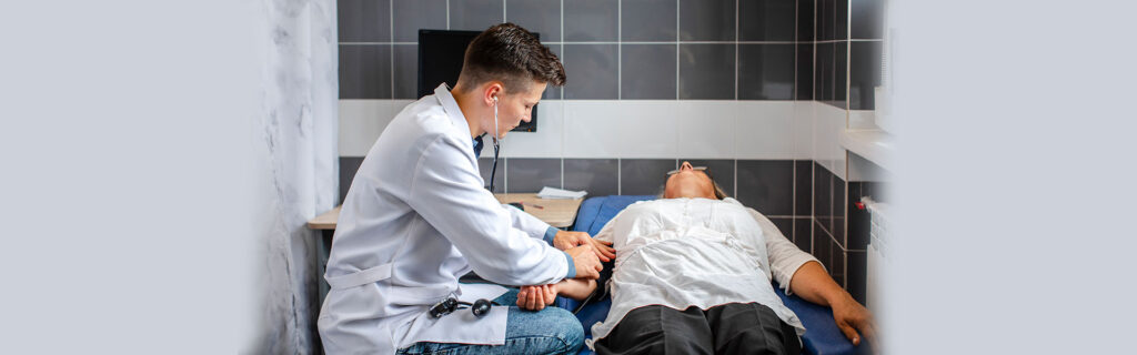 Doctor examining patient with internal bleeding issue at ER in Waco