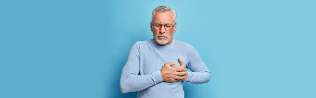 Elderly man experiencing chest pain