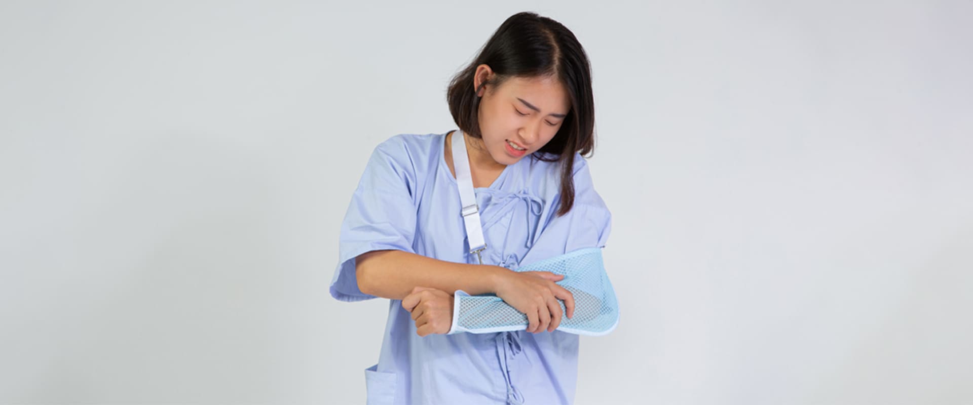A woman with a broken bone is in pain.